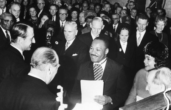 Crown Prince Harald and King Olav of Norway congratulate American civil rights activist Martin Luther King Jr. after he receives the Nobel Peace Prize in Oslo.