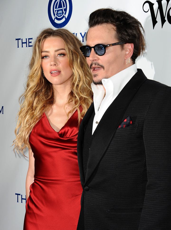 Amber Heard and Johnny Depp attend an event earlier this year