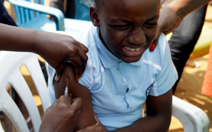 A Congolese child is vaccinated during an emergency campaign of vaccination against yellow fever in Kisenso district, of the