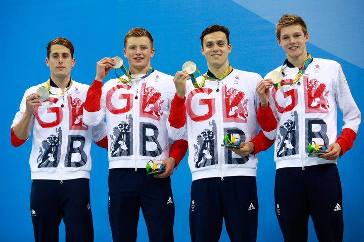 <strong>Scott posed with teammates Chris Walker-Hebborn, Adam Peaty and James Guy with the four's silver medals</strong>