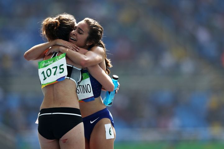 Abbey D'Agostino hugs Nikki Hamblin after Round 1 of the women's 5000-meter in Rio de Janeiro, Brazil.