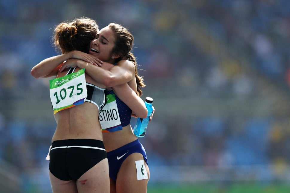 Abbey D'Agostino hugs Nikki Hamblin after Round 1 of the women's 5000-meter in Rio de Janeiro, Brazil.