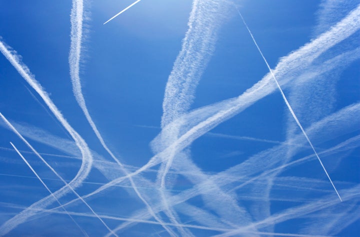 Dozens of scientists say condensation trails like the ones pictured here are NOT the result of a secret government chemical-spraying program.