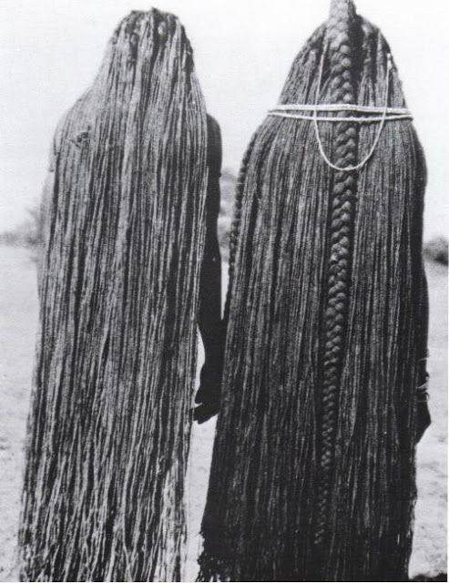 <p>Traditional African Hair Extensions. The hair on these women has been lengthened to their ankles using sinew extensions, Mbalantu of Wambo group, Namibia, Africa Circa 1940's</p>