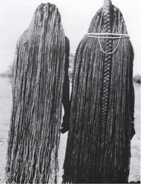 Traditional African Hair Extensions. The hair on these women has been lengthened to their ankles using sinew extensions, Mbalantu of Wambo group, Namibia, Africa Circa 1940's