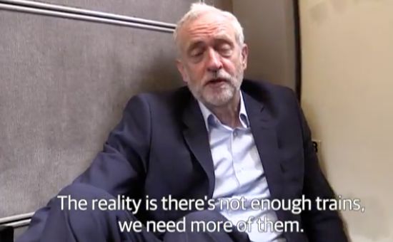 Jeremy Corbyn on the floor of a crowded train