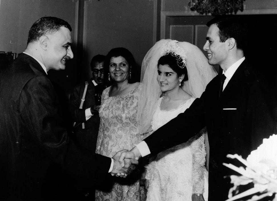 Nasser shakes hands with Marwan at the wedding. 