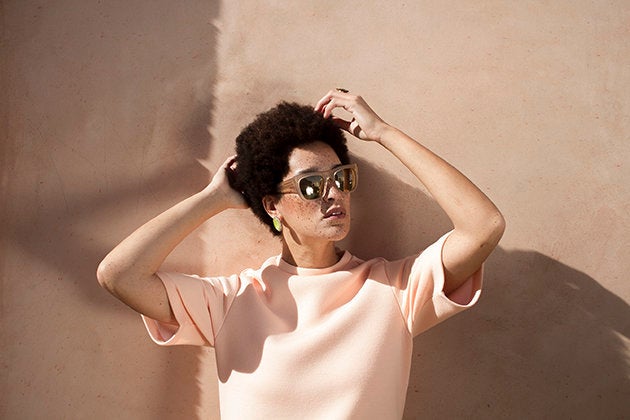 A woman and her 'fro pose for CRWN. 