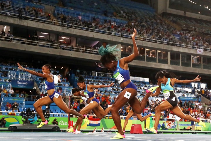 Brianna Rollins of the United States (L) wins the gold medal in the Women's 100m Hurdles Final.