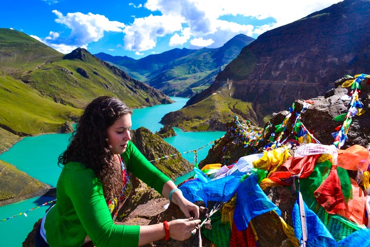 Hanging prayer flags in Tibet