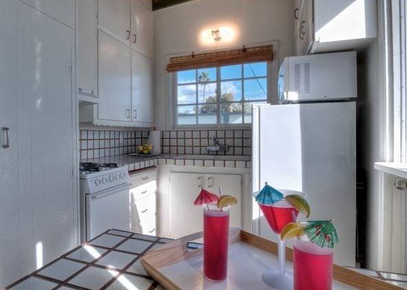 The Malibu bungalow's beachy, all-white kitchen.