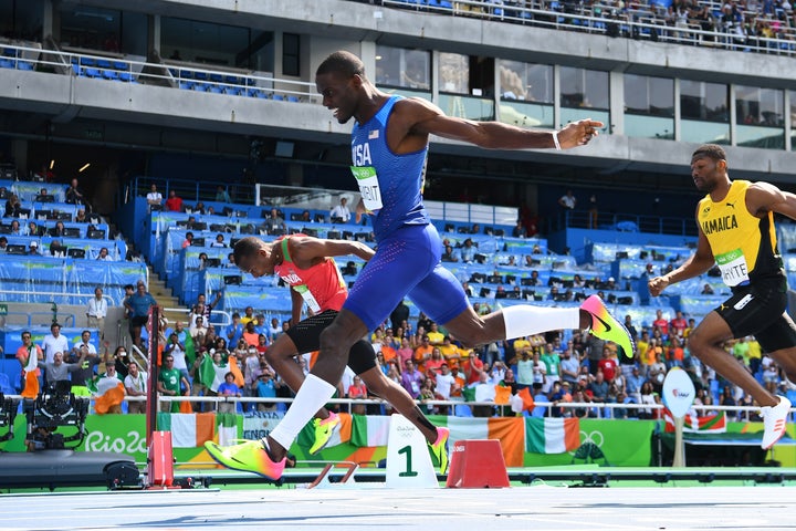 Kerron Clement crosses the finish line first in the 400 hurdles final.