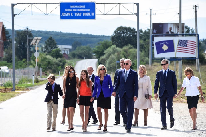 U.S. Vice President Joe Biden, joined by his wife Dr. Jill Biden and other family members, walks on a national road named after his late son, Joseph "Beau" Biden, near the village of Sojeve on August 17, 2016.