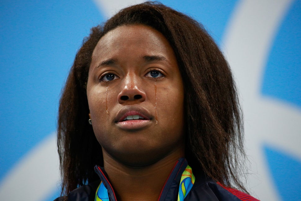 Simone Manuel of the United States celebrates on the podium during the medal ceremony for the Women's 100m Freestyle Final at