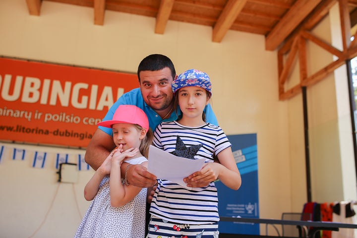 Daniel Tsomik and his two daughters making lasting memories at a Jewish family camp in the Baltics