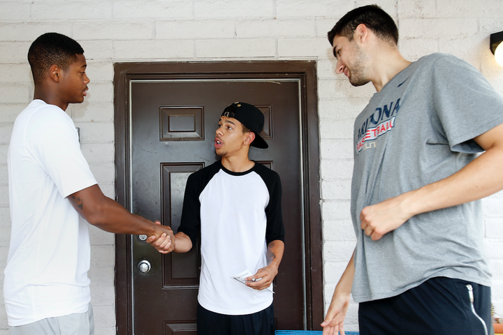 University of Arizona basketball players talk with a high school dropout about why he should return to school. 