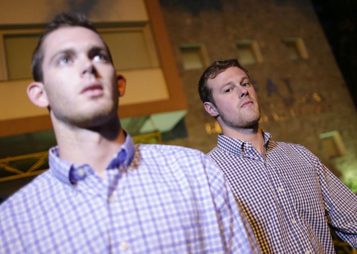 U.S. Olympic swimmers Jack Conger and Gunnar Bentz leave a police station after being questioned in Rio de Janeiro.
