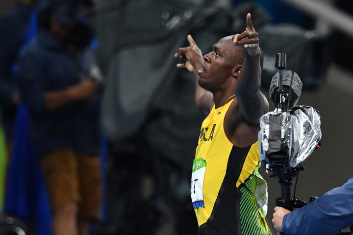 Usain Bolt celebrates after winning the Men's 200m Final at the 2016 Olympic Games in Rio de Janeiro on August 18, 2016.