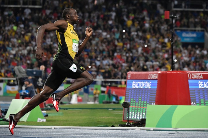 Usain Bolt competes in the men's 200m Final at the Rio 2016 Olympic Games at the Olympic Stadium in Rio de Janeiro on August 18, 2016.