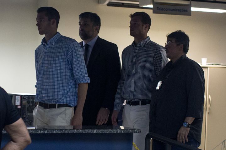 <strong>Gunnar Bentz (F-L) and Jack Conger (2nd from R) are seen leaving the police station after questioning</strong>