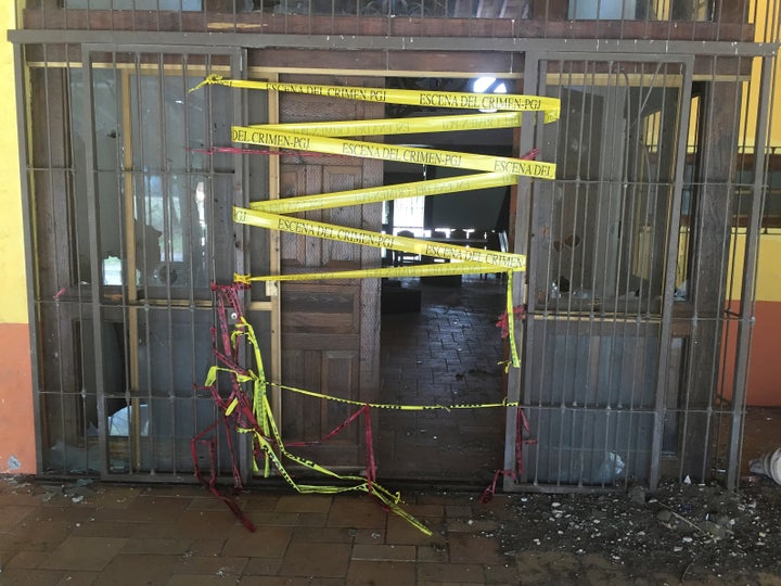 Police tape is seen at a ranch where 42 men died after a firefight of armed civilians with federal forces in the violent west