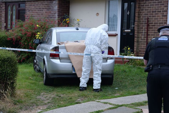 <strong>A forensics officer examines evidence at the scene of the attack </strong>