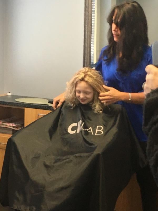 Transitions Hair Solutions owner Danielle Marzella Grillo outfits Amelia Sholty with her first wig in December 2015.