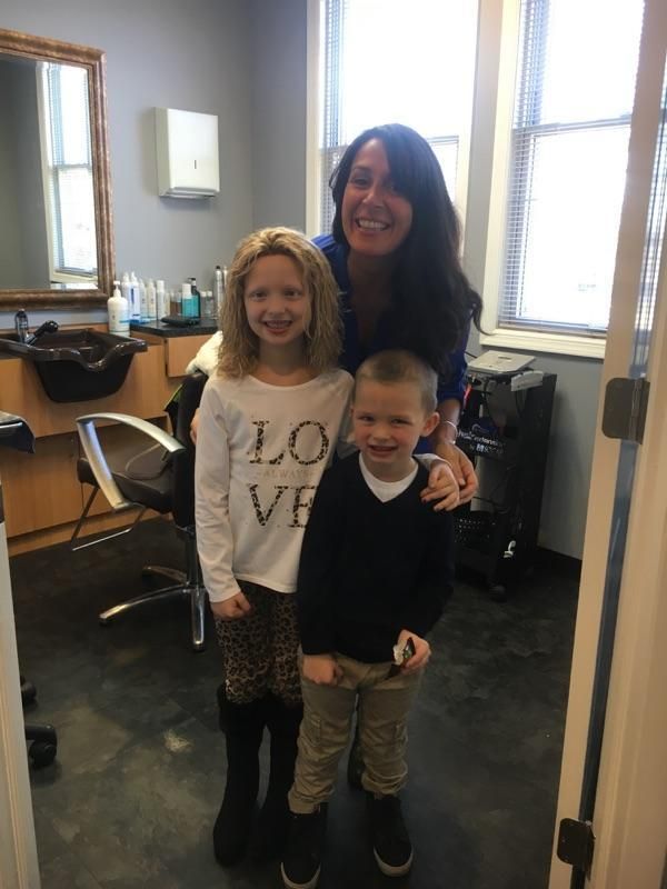 Amelia Sholty with Transitions Hair Solutions owner Danielle Marzella Grillo and her little brother Liam. 