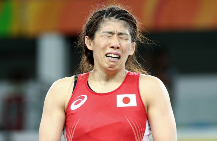 The beaten legend, Saori Yoshida, weeps in disappointment afterward.