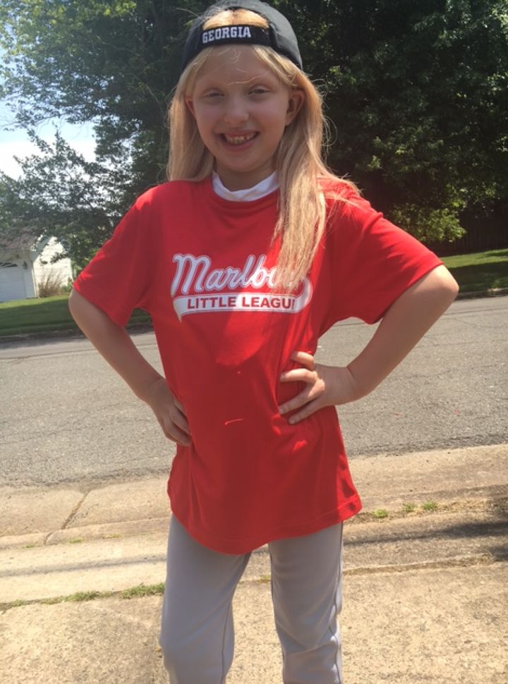 Amelia dressed for baseball this summer.