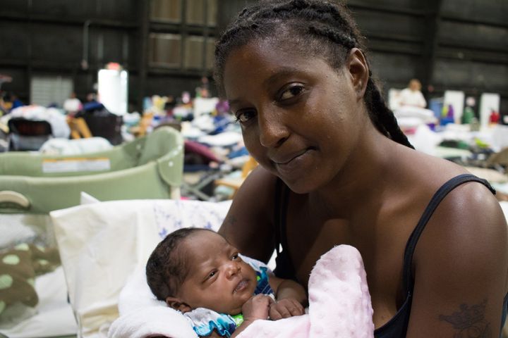Vernesha and her 3-week-old baby niece, Joy, are staying at a shelter in Baton Rouge after being driven from their home by rising floodwaters on Saturday, Aug. 13. They live together with Joy’s mother and two older sisters in an apartment that is now underwater. 