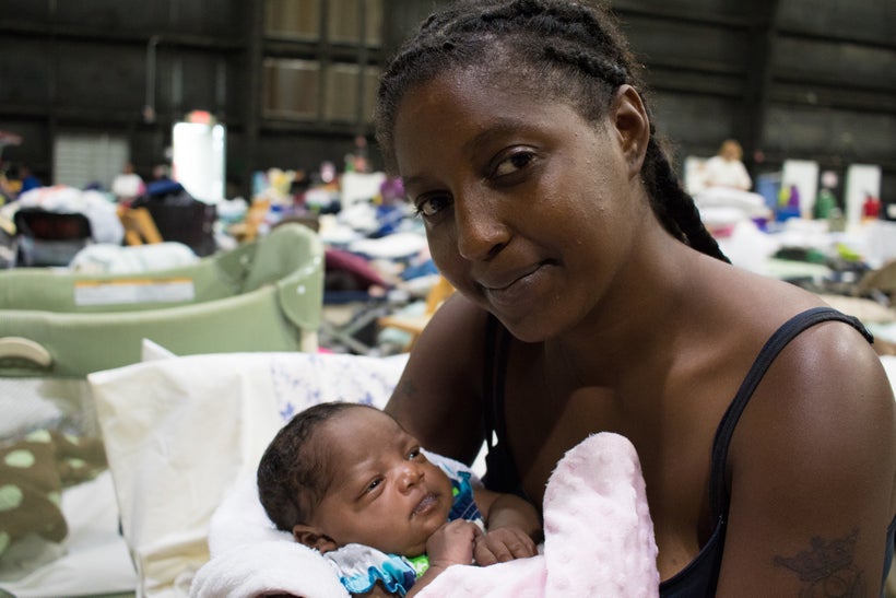 <i>Vernesha and her 3-week-old baby niece, Joy, are staying at a shelter in Baton Rouge after being driven from their home by
