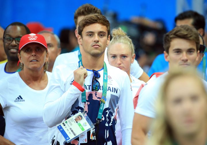 Gold medal hope: Tom Daley looks to the scoreboard following the Women's 3m Springboard Final on Day