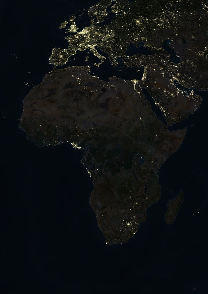 True colour satellite image of Africa at night. This image in Lambert Azimuthal Equal Area projection was compiled from data acquired by LANDSAT 5 & 7 satellites., Africa At Night, True Colour Satellite Image (Photo by Planet Observer/Universal Images Group via Getty Images)