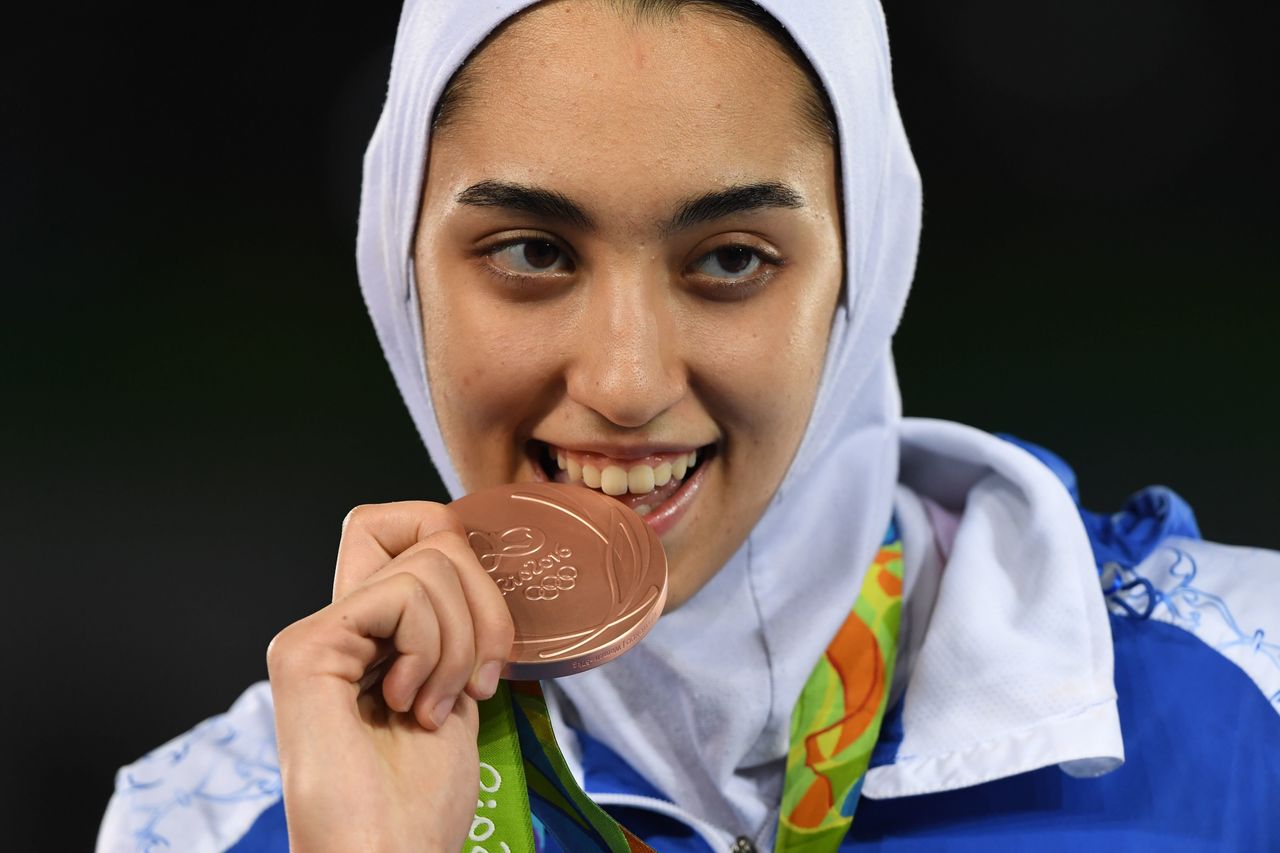 Kimia Alizadeh Zenoorin poses with her bronze medal after the women's taekwondo event in the 57kg category at the Rio 2016 Olympic Games.