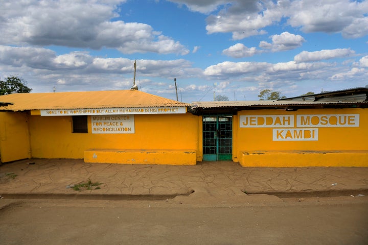 A mosque painted yellow for "Colour in Faith."