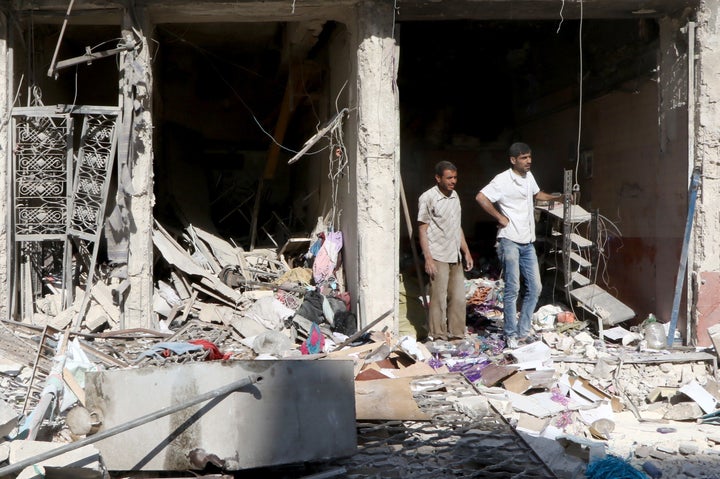 Debris of the buildings are seen after a helicopter belonging to Syrian army hit the residential area with barrel bombs, over opposition controlled Salihin neighborhood of Aleppo, Syria on August 18, 2016.