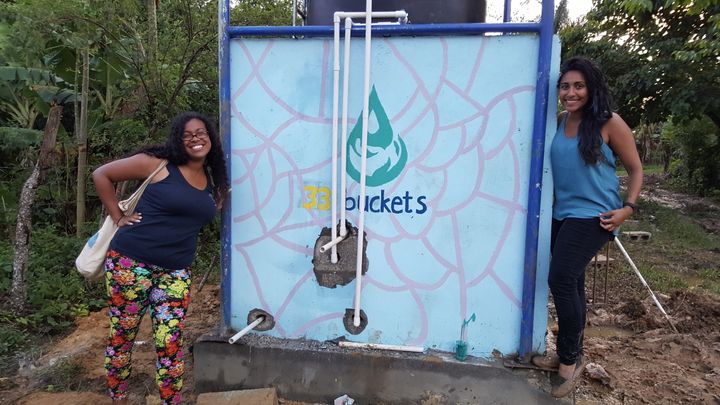 CEO, Alyssa Ramos-Reynoso (left) and Binita Mandalia, Coordinator of Service Learning Trips (right) posing proudly next to the finished system!
