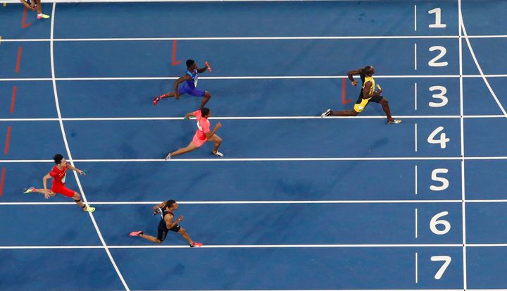 Usain Bolt races toward the finish line for his ninth Olympic gold.