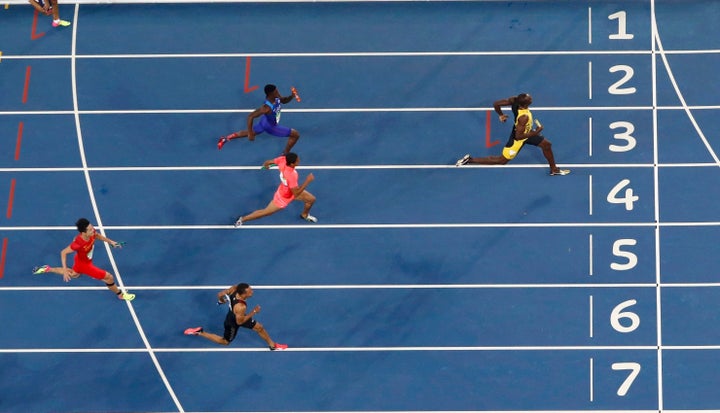 Usain Bolt races toward the finish line for his ninth Olympic gold.