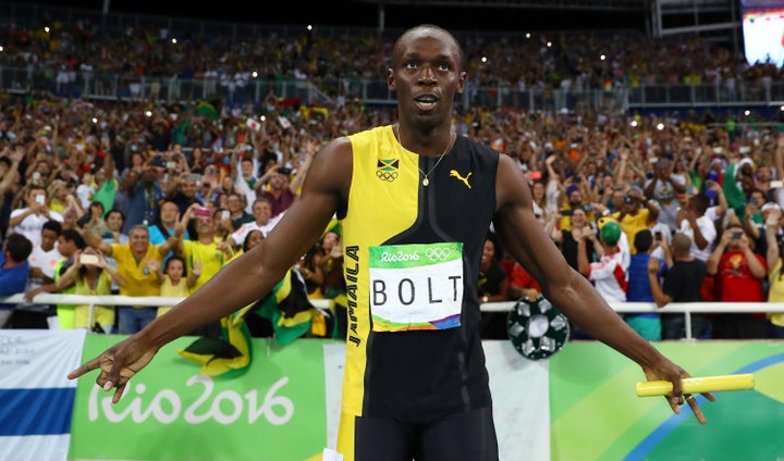 Usain Bolt celebrates after winning his third gold medal of the Rio Olympics on Friday.