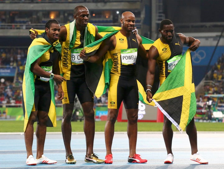 Asafa Powell, Yohan Blake, Nickel Ashmeade and Usain Bolt of Jamaica celebrate their first-place finish in the men's 4x100-me