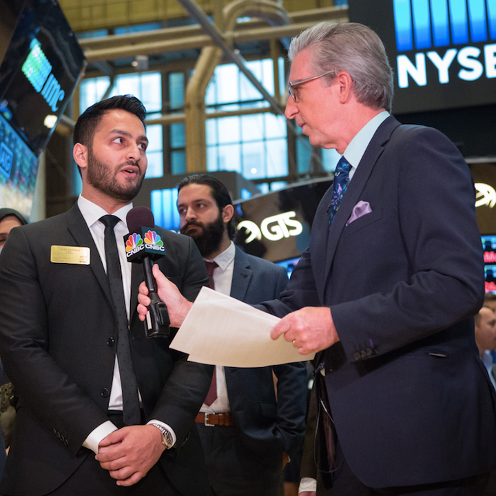 Pictured: Asad Saddique (left) being interviewed at NYSE by CNBC