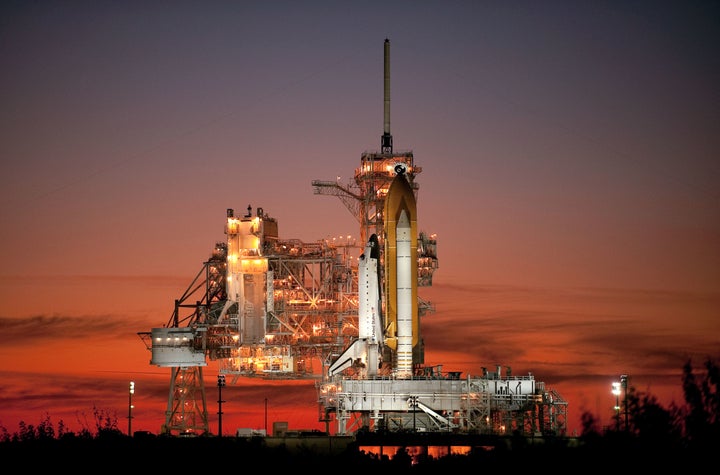 Space shuttle Atlantis sits on the launch pad prior to launch in November 2009. The twilight photo was used on the cover of NASA’s fiscal year 2011 budget as a nod to the final days of the shuttle program.