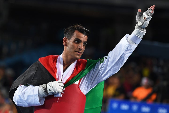 Jordan's Ahmad Abughaush celebrates after winning the men's taekwondo gold medal in the -68kg category on Aug. 18, 2016.