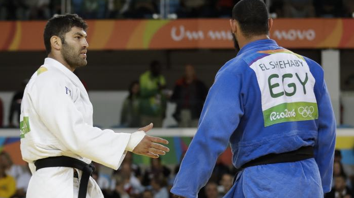 A hand not shaken saw the competitor on the right sent home from the Games