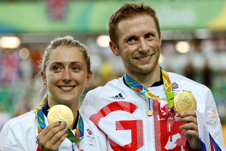 Laura Trott and Jason Kenny pose with their gold medals at the Rio Olympic Velodrome.
