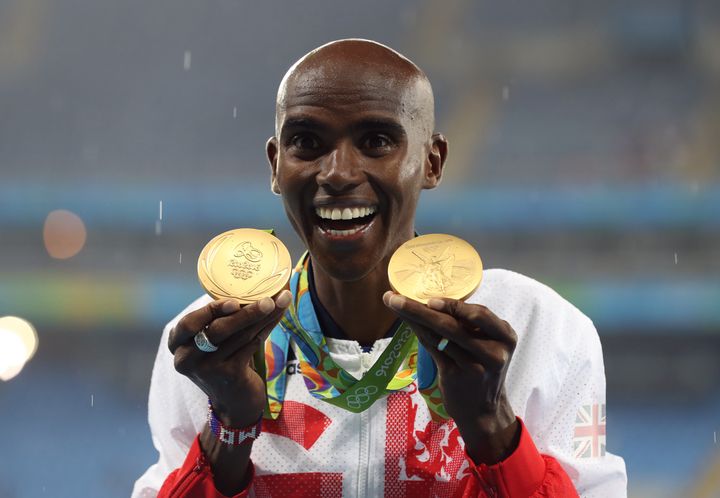 Mo Farah with his gold medals for victory in the 5,000m and 10,000m.