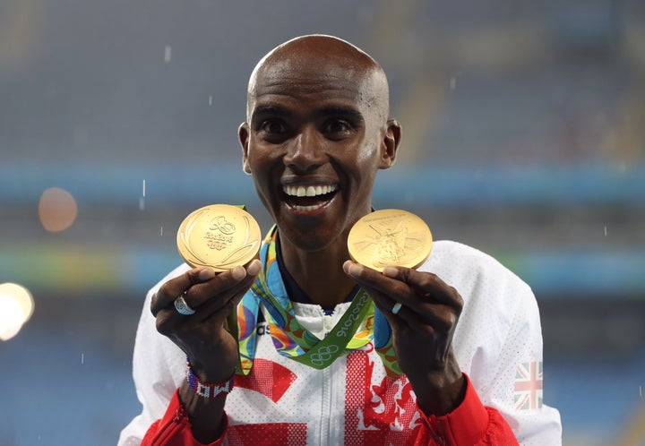 <strong>Mo Farah with his gold medals for victory in the 5,000m and 10,000m.</strong>