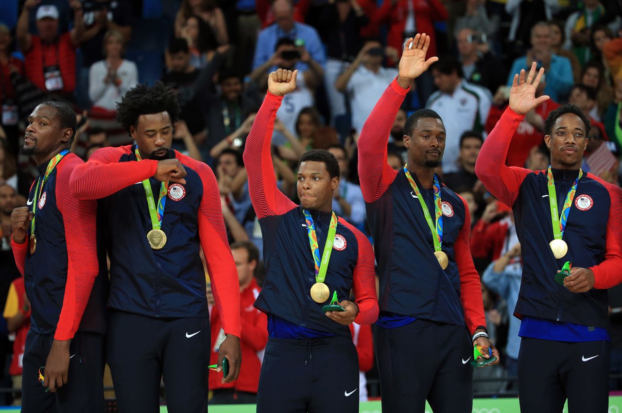 Kevin Durant #5, DeAndre Jordan #6, Kyle Lowry #7, Harrison Barnes #8 and DeMar DeRozan #9 of the USA celebrate after winning the Men's Gold medal game.